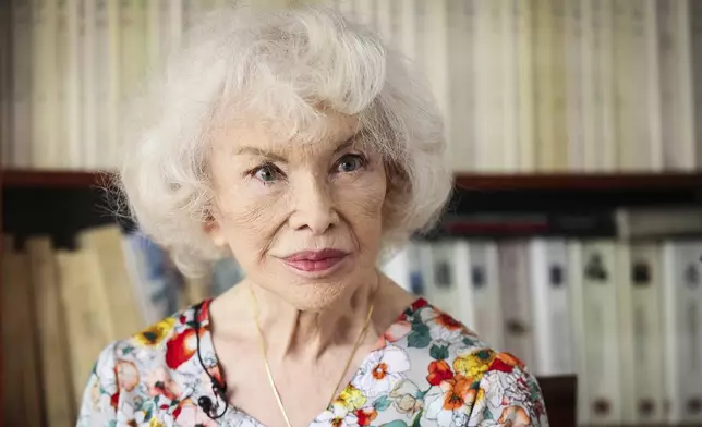 Marie-Pierre Pruvot, 89, known as Bambi, one of the first trans women in the world to become a public star, and a pioneer in global LGBTQ+ history, poses during an interview with the Associated Press, in Pantin, outside Paris, Tuesday, May 20, 2025. (AP Photo/Thomas Padilla)