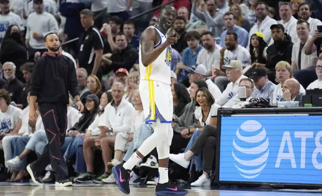 Golden State Warriors forward Draymond Green (23) points toward a referee during the first half of Game 2 of an NBA basketball second-round playoff series against the Minnesota Timberwolves, Thursday, May 8, 2025, in Minneapolis. (AP Photo/Abbie Parr)