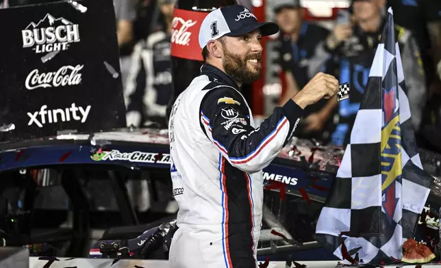 Ross Chastain celebrates in Victory Lane after winning a NASCAR Cup Series auto race at Charlotte Motor Speedway, Sunday, May 25, 2025, in Concord, N.C. (AP Photo/Matt Kelley)
