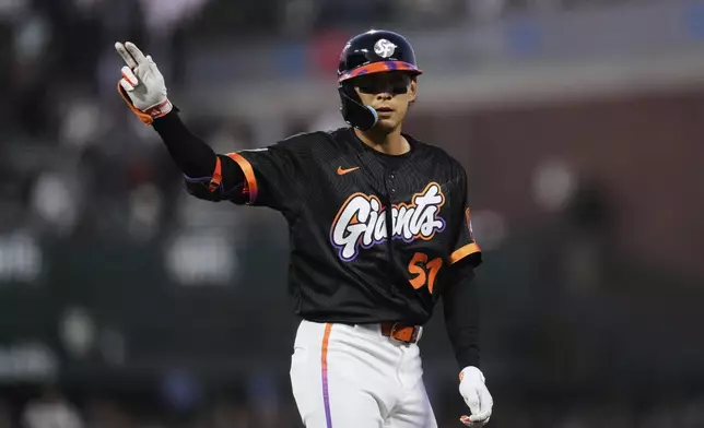 San Francisco Giants' Jung Hoo Lee reacts after hitting an RBI single during the fifth inning of a baseball game against the Kansas City Royals, Tuesday, May 20, 2025, in San Francisco. (AP Photo/Godofredo A. Vásquez)