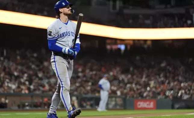 Kansas City Royals' Bobby Witt Jr. walks to the dugout after striking out during the sixth inning of a baseball game against the San Francisco Giants, Tuesday, May 20, 2025, in San Francisco. (AP Photo/Godofredo A. Vásquez)