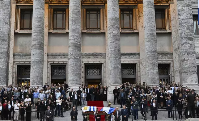 The casket of late former President Jose Mujica stands outside the Legislative Palace after funeral ceremonies in Montevideo, Uruguay, Thursday, May 15, 2025. (AP Photo/Santiago Mazzarovich)