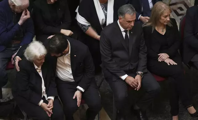 Chile's President Gabriel Boric offers condolences to Lucia Topolansky, widow of former Uruguayan President Jose Mujica, during funeral ceremonies at the Legislative Palace in Montevideo, Uruguay, Thursday, May 15, 2025. Second from right is Uruguayan President Yamandu Orsi and his wife Laura Alonsopere, right. I(AP Photo/Matilde Campodonico)