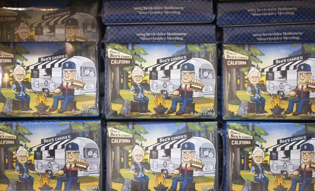 Boxes of See's Candies featuring an image of Warren Buffett at a campsite with See's Candies' namesake Mrs. See in CHI Health Center Omaha for the Berkshire Hathaway annual meeting Saturday, May 3, 2025, in Omaha, Neb. (AP Photo/Rebecca S. Gratz)