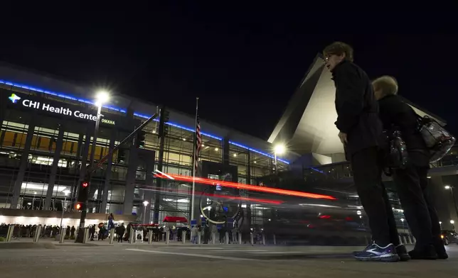 Shareholders arrive outside CHI Health Center Omaha for the Berkshire Hathaway annual meeting Saturday, May 3, 2025, in Omaha, Neb. (AP Photo/Rebecca S. Gratz)