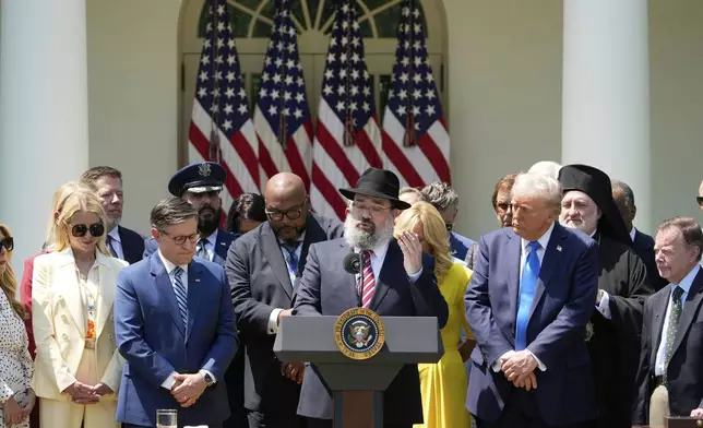 Rabbi Levi Shemtov, with President Donald Trump and others, leads a prayer during a National Day of Prayer event in the Rose Garden of the White House, Thursday, May 1, 2025, in Washington. (AP Photo/Alex Brandon)