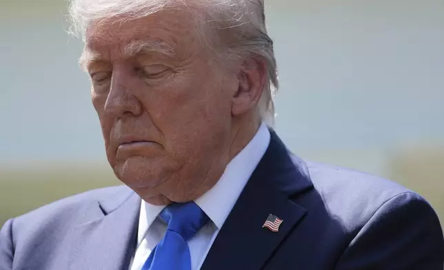 President Donald Trump listens during a National Day of Prayer event in the Rose Garden of the White House, Thursday, May 1, 2025, in Washington. (AP Photo/Evan Vucci)