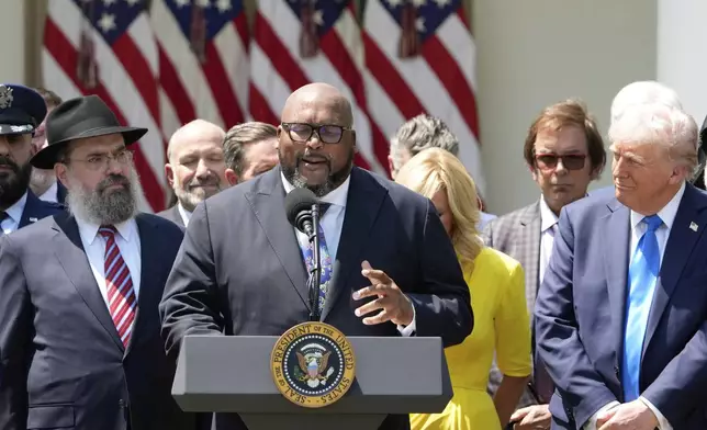 Bishop Kelvin Cobaris prays with from left, Rabbi Levi Shemtov,Pastor Paula White and President Donald Trump, during a National Day of Prayer event in the Rose Garden of the White House, Thursday, May 1, 2025, in Washington. (AP Photo/Alex Brandon)