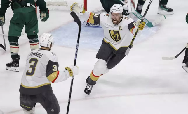 Vegas Golden Knights right wing Mark Stone (61) celebrates after scoring against Minnesota Wild goaltender Filip Gustavsson during the third period of Game 6 of a first-round NHL hockey playoff series Thursday, May 1, 2025, in St. Paul, Minn. (AP Photo/Bailey Hillesheim)