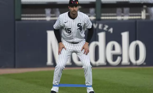 Chicago White Sox's Austin Slater warms up before a baseball game against the Seattle Mariners in Chicago, Monday, May 19, 2025. (AP Photo/Nam Y. Huh)