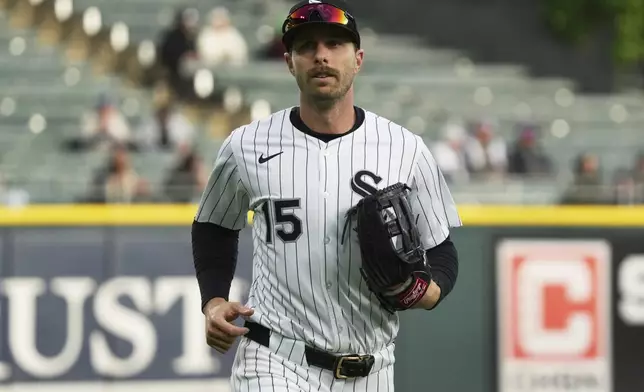 Chicago White Sox's Austin Slater runs back to the dugout during the first inning of a baseball game against the Seattle Mariners in Chicago, Monday, May 19, 2025. (AP Photo/Nam Y. Huh)