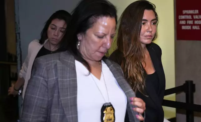 Miriam Haley, right, an accuser testifying at Harvey Weinstein's rape trial, leaves the courtroom during a break in New York, Wednesday, April 30, 2025. (AP Photo/Seth Wenig)