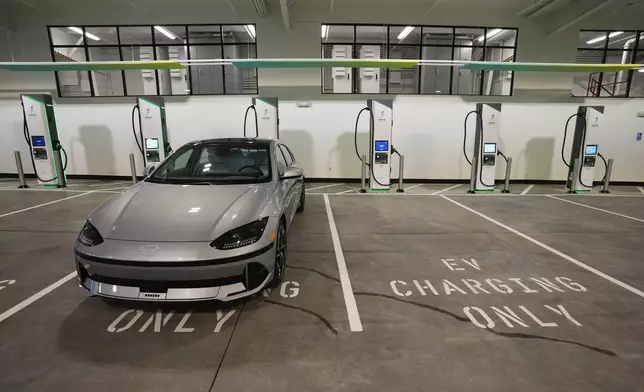 FILE - Charging bays are seen at the new Electrify America indoor electric vehicle charging station in San Francisco, Wednesday, Feb. 7, 2024. (AP Photo/Eric Risberg, File)