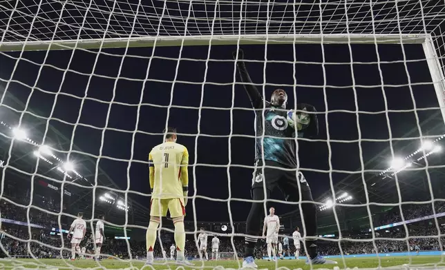 Minnesota United forward Bongokuhle Hlongwane, front right, celebrates after a goal by midfielder Joaquin Pereyra (26) during the second half of an MLS soccer match against St. Louis City, Saturday, May 17, 2025, in St. Paul, Minn. (AP Photo/Abbie Parr)