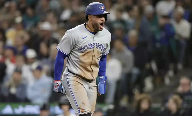 Toronto Blue Jays' George Springer rounds third on his way to score against the Seattle Mariners during the eighth inning of a baseball game, Saturday, May 10, 2025, in Seattle. (AP Photo/John Froschauer)
