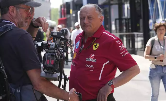 Ferrari team principal Frederic Vasseur watches in the paddock at the Enzo and Dino Ferrari racetrack, ahead the Italy's Emilia Romagna Formula One Grand Prix in Imola, Italy, Thursday, May 15, 2025. (AP Photo/Antonio Calanni)