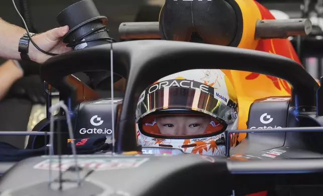 Red Bull driver Yuki Tsunoda of Japan sits in his car during the first free practice at the Enzo and Dino Ferrari racetrack, ahead the Italy's Emilia Romagna Formula One Grand Prix, in Imola, Italy, Friday, May 16, 2025. (AP Photo/Antonio Calanni)