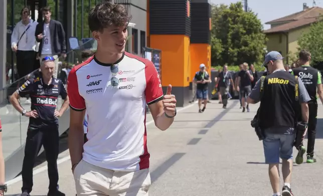 Haas driver Oliver Bearman of Britain arrives for the first free practice at the Enzo and Dino Ferrari racetrack, ahead the Italy's Emilia Romagna Formula One Grand Prix, in Imola, Italy, Friday, May 16, 2025. (AP Photo/Antonio Calanni)