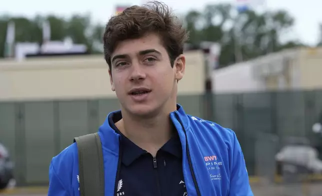 Alpine driver Franco Colapinto of Argentina arrives prior to the first free practice at the Enzo and Dino Ferrari racetrack, ahead the Italy's Emilia Romagna Formula One Grand Prix, in Imola, Italy, Friday, May 16, 2025. (AP Photo/Luca Bruno)
