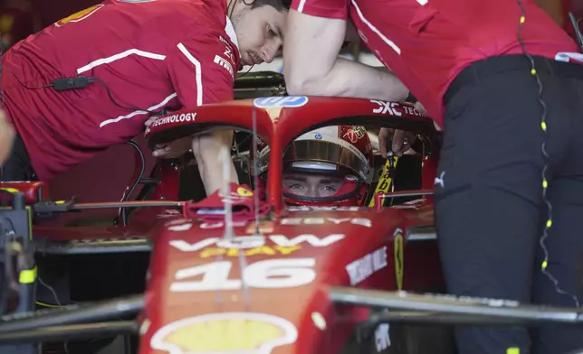 Ferrari driver Charles Leclerc of Monaco prepares for the first free practice at the Enzo and Dino Ferrari racetrack, ahead the Italy's Emilia Romagna Formula One Grand Prix, in Imola, Italy, Friday, May 16, 2025. (AP Photo/Antonio Calanni)