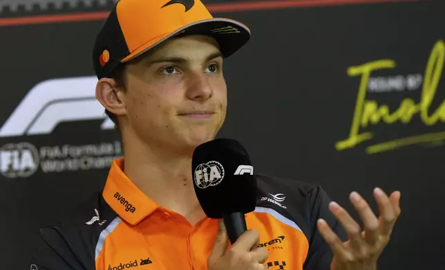 McLaren driver Oscar Piastri of Australia answers reporters during a news conference at the Enzo and Dino Ferrari racetrack, ahead the Italy's Emilia Romagna Formula One Grand Prix in Imola, Italy, Thursday, May 15, 2025. (AP Photo/Luca Bruno)