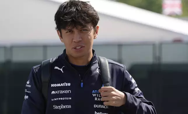 Williams driver Alexander Albon of Thailand arrives prior to the first free practice at the Enzo and Dino Ferrari racetrack, ahead the Italy's Emilia Romagna Formula One Grand Prix, in Imola, Italy, Friday, May 16, 2025. (AP Photo/Luca Bruno)