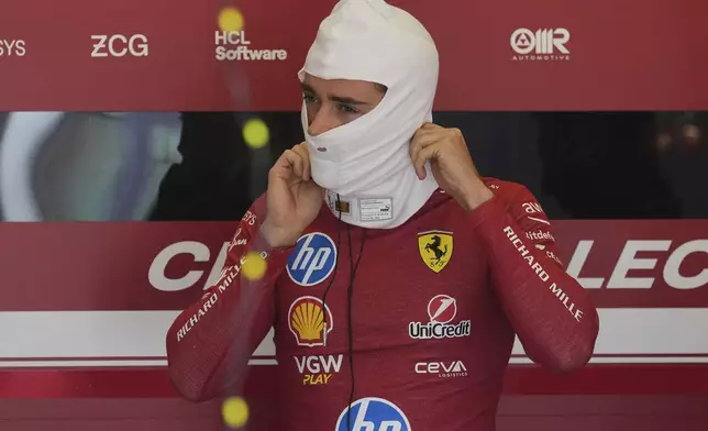 Ferrari driver Charles Leclerc of Monaco prepares for the first free practice at the Enzo and Dino Ferrari racetrack, ahead the Italy's Emilia Romagna Formula One Grand Prix, in Imola, Italy, Friday, May 16, 2025. (AP Photo/Antonio Calanni)