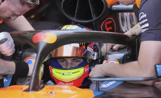 McLaren driver Oscar Piastri of Australia sits in his car during the first free practice at the Enzo and Dino Ferrari racetrack, ahead the Italy's Emilia Romagna Formula One Grand Prix, in Imola, Italy, Friday, May 16, 2025. (AP Photo/Antonio Calanni)