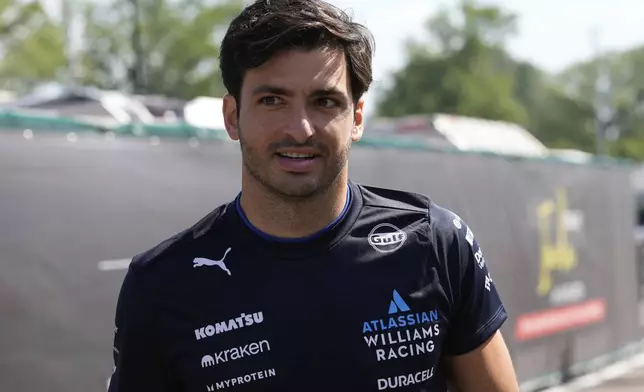 Williams driver Carlos Sainz of Spain arrives prior to the first free practice at the Enzo and Dino Ferrari racetrack, ahead the Italy's Emilia Romagna Formula One Grand Prix, in Imola, Italy, Friday, May 16, 2025. (AP Photo/Luca Bruno)