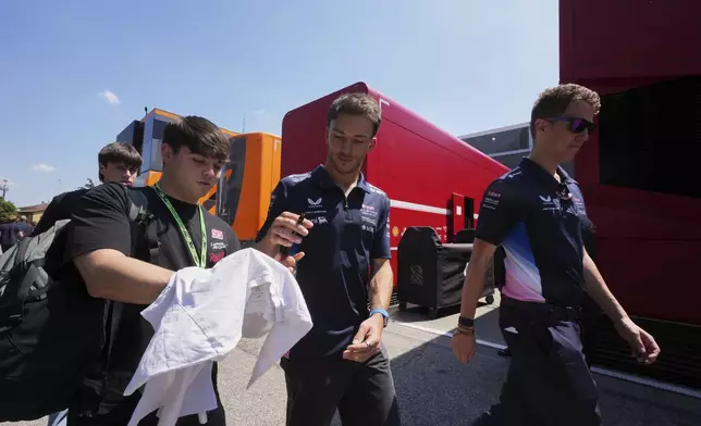 Alpine driver Franco Colapinto of Argentina arrives for the first free practice at the Enzo and Dino Ferrari racetrack, ahead the Italy's Emilia Romagna Formula One Grand Prix, in Imola, Italy, Friday, May 16, 2025. (AP Photo/Antonio Calanni)