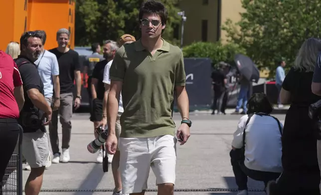 Aston Martin driver Lance Stroll of Canada arrives at the Dino and Enzo Ferrari racetrack, ahead the Italy's Emilia Romagna Formula One Grand Prix in Imola, Italy, Thursday, May 15, 2025. (AP Photo/Antonio Calanni)