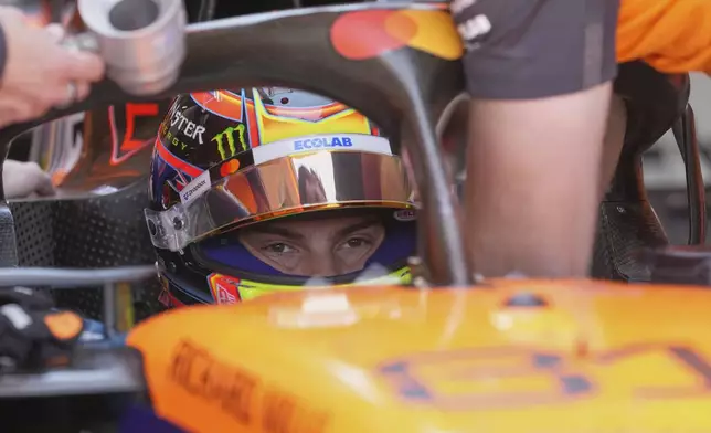 McLaren driver Oscar Piastri of Australia sits in his car during the first free practice at the Enzo and Dino Ferrari racetrack, ahead the Italy's Emilia Romagna Formula One Grand Prix, in Imola, Italy, Friday, May 16, 2025. (AP Photo/Antonio Calanni)