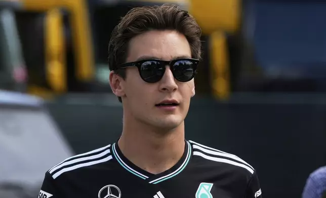 Mercedes driver George Russell of Britain arrives prior to the first free practice at the Enzo and Dino Ferrari racetrack, ahead the Italy's Emilia Romagna Formula One Grand Prix, in Imola, Italy, Friday, May 16, 2025. (AP Photo/Luca Bruno)