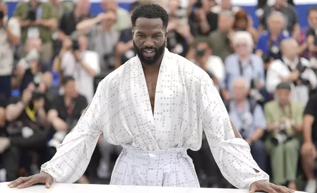 Sope Dirisu poses for photographers at the photo call for the film 'My Father's Shadow' at the 78th international film festival, Cannes, southern France, Sunday, May 18, 2025. (AP Photo/Natacha Pisarenko)