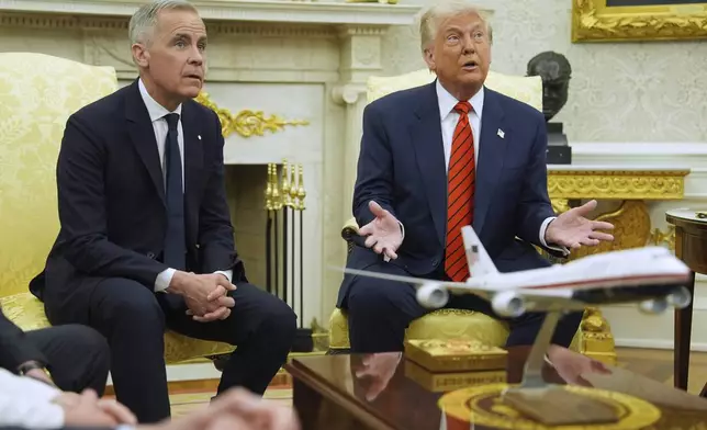 President Donald Trump meets Canadian Prime Minister Mark Carney in the Oval Office of the White House, Tuesday, May 6, 2025, in Washington. (AP Photo/Evan Vucci)