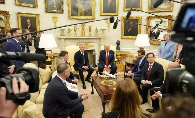 Canada Prime Minister Mark Carney and U.S. President Donald Trump engage in a meeting at the White House in Washington, Tuesday, May 6, 2025. (Adrian Wyld/The Canadian Press via AP)