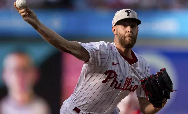 Philadelphia Phillies starting pitcher Zack Wheeler delivers during the first inning of a baseball game against the Pittsburgh Pirates, Saturday, May 17, 2025, in Philadelphia. (AP Photo/Chris Szagola)