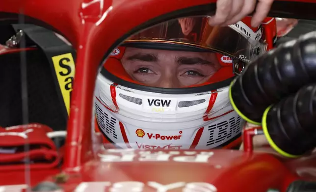 Ferrari driver Charles Leclerc of Monaco sits in his car during the second free practice ahead of the Spanish Grand Prix Formula One race at the Barcelona Catalunya racetrack in Montmelo, near Barcelona, Spain, Friday, May 30, 2025. (AP Photo/Joan Monfort)