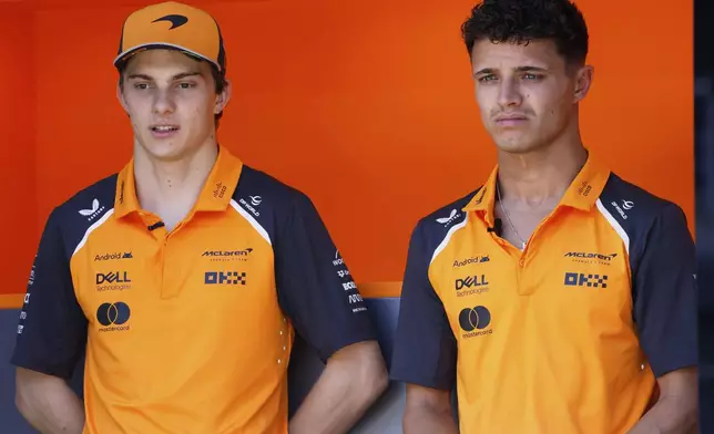 Oscar Piastri, of Australia, left, and Lando Norris, of United Kingdom, during a press conference at the Barcelona Catalunya racetrack in Montmelo, near Barcelona, Spain, Thursday May 29, 2025. The Spanish Grand Prix Formula One race will be held on Sunday. (AP Photo/Joan Monfort)