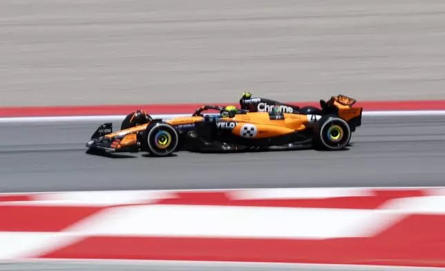 McLaren driver Lando Norris of Britain steers his car during the first free practice ahead of the Spanish Grand Prix Formula One race at the Barcelona Catalunya racetrack in Montmelo, near Barcelona, Spain, Friday, May 30, 2025. (AP Photo/Joan Monfort)