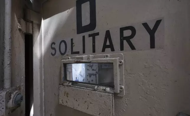 The door to a solitary confinement cell is shown on Alcatraz Island Monday, May 5, 2025, in San Francisco. (AP Photo/Jed Jacobsohn)