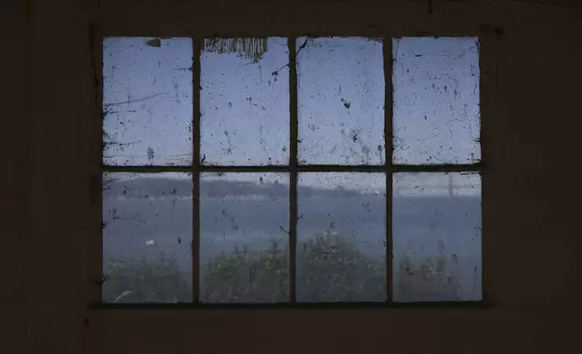 The exterior of Alcatraz Island is shown from a window inside the prison Monday, May 5, 2025, in San Francisco. (AP Photo/Jed Jacobsohn)