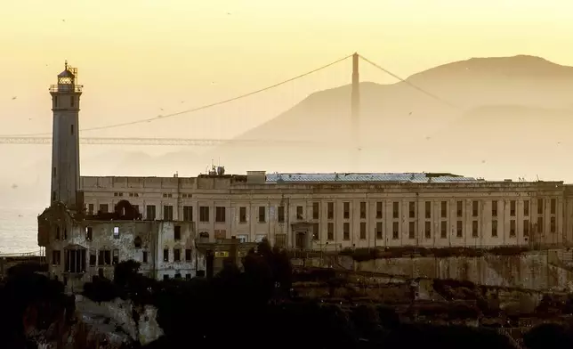 With the Golden Gate Bridge in behind, Alcatraz Island is pictured on Sunday, May 4, 2025, in the San Francisco Bay, Calif. (AP Photo/Noah Berger)