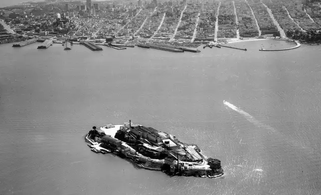 FILE - The federal prison island Alcatraz, known as "The Rock," stands in the San Francisco Bay, California, July 21, 1950. (AP Photo, File)