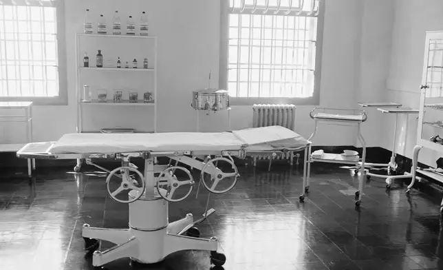 FILE - The hospital operating room is photographed through the glass of a locked door at the Alcatraz Federal Penitentiary prison in the San Francisco Bay, California, March 13, 1956. (AP Photo/Ernest K. Bennett, File)