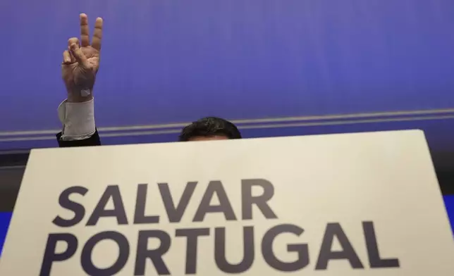 "The hard-right populist party Chega" leader Andre Ventura gestures while addressing media and his supporters, following Portugal's general election, in Lisbon, Monday, May 19, 2025. (AP Photo/Ana Brigida)