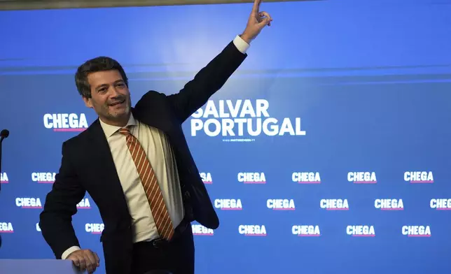"The hard-right populist party Chega" leader Andre Ventura gestures before addressing media and his supporters, following Portugal's general election, in Lisbon, Monday, May 19, 2025. (AP Photo/Ana Brigida)