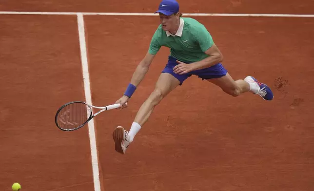 Italy's Jannik Sinner reaches for the ball as she plays Jiri Lehecka of the Czech Republic during their third round match of the French Tennis Open, at the Roland-Garros stadium, in Paris, Saturday, May 31, 2025. (AP Photo/Thibault Camus)