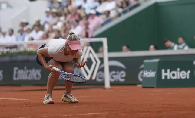 Kazakhstan's Yulia Putintseva reacts as she plays Russia's Mirra Andreeva during their third round match of the French Tennis Open, at the Roland-Garros stadium, in Paris, Saturday, May 31, 2025. (AP Photo/Christophe Ena)