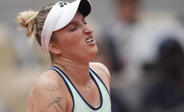 Marketa Vondrousova of the Czech Republic reacts as she plays Jessica Pegula of the U.S. during their third round match of the French Tennis Open, at the Roland-Garros stadium, in Paris, Saturday, May 31, 2025. (AP Photo/Christophe Ena)